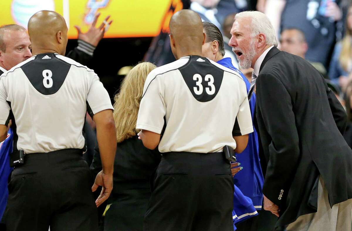 San Antonio Spurs head coach Gregg Popovich complains to officials Marc Davis (left) and Sean Corbin after Game 2 in the Western Conference semifinals against the Oklahoma City Thunder Monday May 2, 2016 at the AT&T Center. The Thunder won 98-97.
