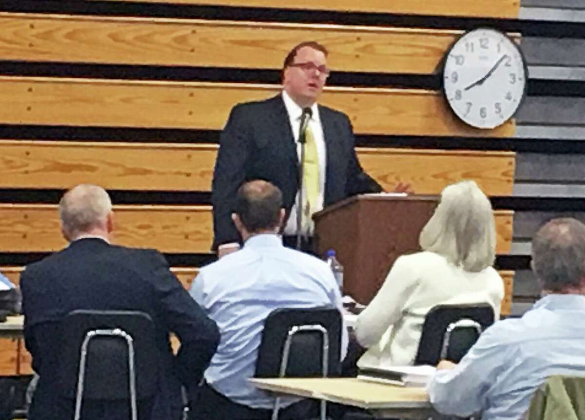 Representative Town Meeting member Michael Herley, R-10, urged the legislative body to adopt the town budget without any reductions.