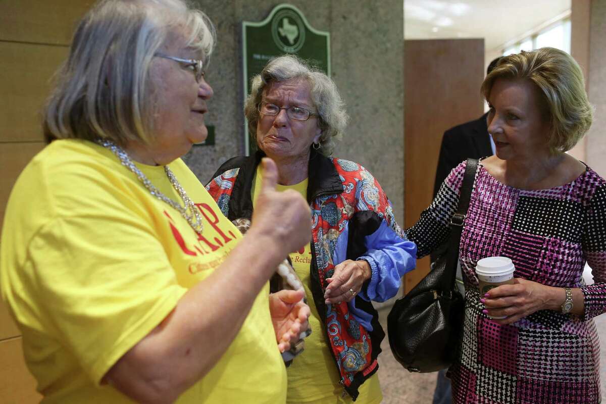 Morrison (right) listens to an emotional Hull (center) and to Level after the Texas Railroad Commission granted a permit for an oil field landfill on the outskirts of Nordheim. Morrison said she told commissioners she understood that they couldn’t consider the ramifications of permits — an issue she said should be tackled in the next legislative session while the agency is under Sunset Review.