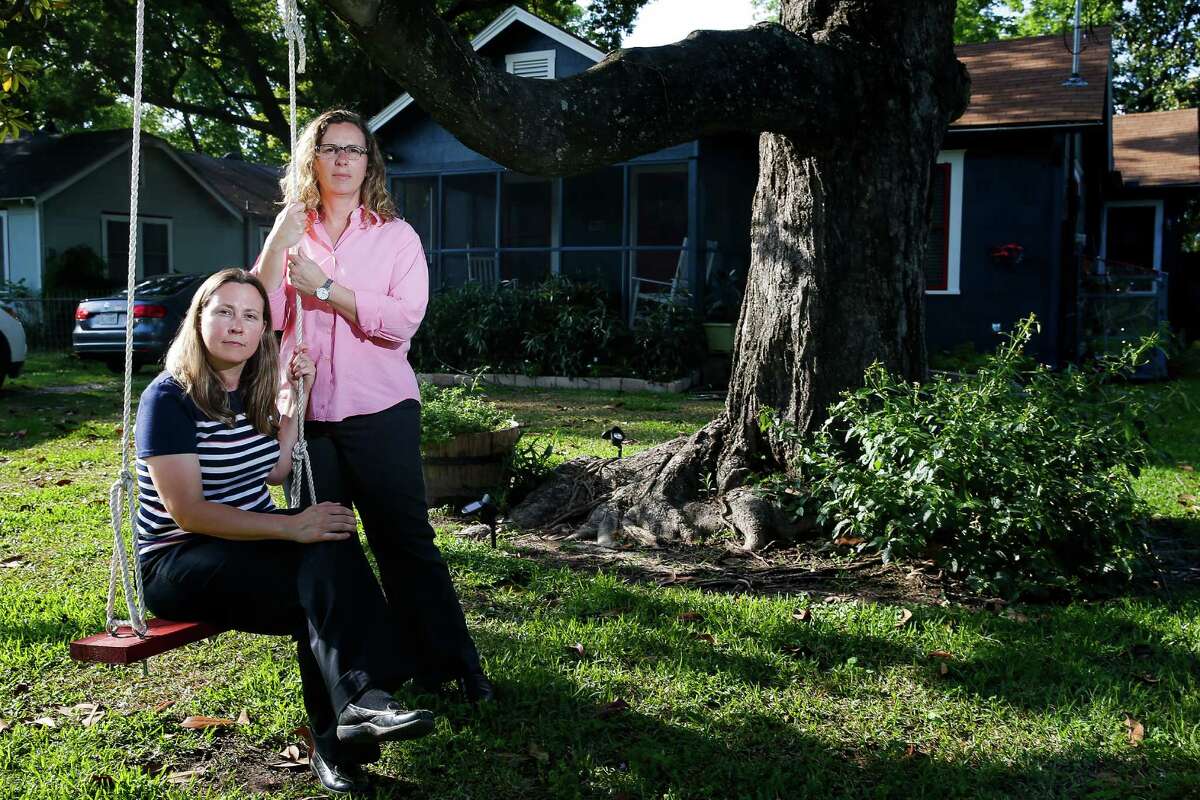 Foster parents Carol Jeffery, left, and Angela Sugarek sit on a swing they built for their two foster children Wednesday, April 27, 2016 in Houston. The couple had the two bothers, ages three and four, taken away from them by Child Protective Services after reporting that they believed the younger child was being abused by an older brother. ( Michael Ciaglo / Houston Chronicle )