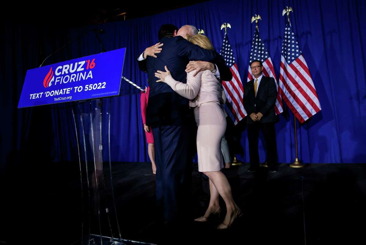 Sen. Ted Cruz hugs his father, Rafael, and wife, Heidi, after announcing that he would suspend his presidential campaign at a primary night rally in Indianapolis, May 3, 2016. After Donald Trump was projected as the winner of Indiana’s Republican primary, Cruz announced his withdrawal, all but assuring that Donald Trump will be the Republican nominee. (Eric Thayer/The New York Times)