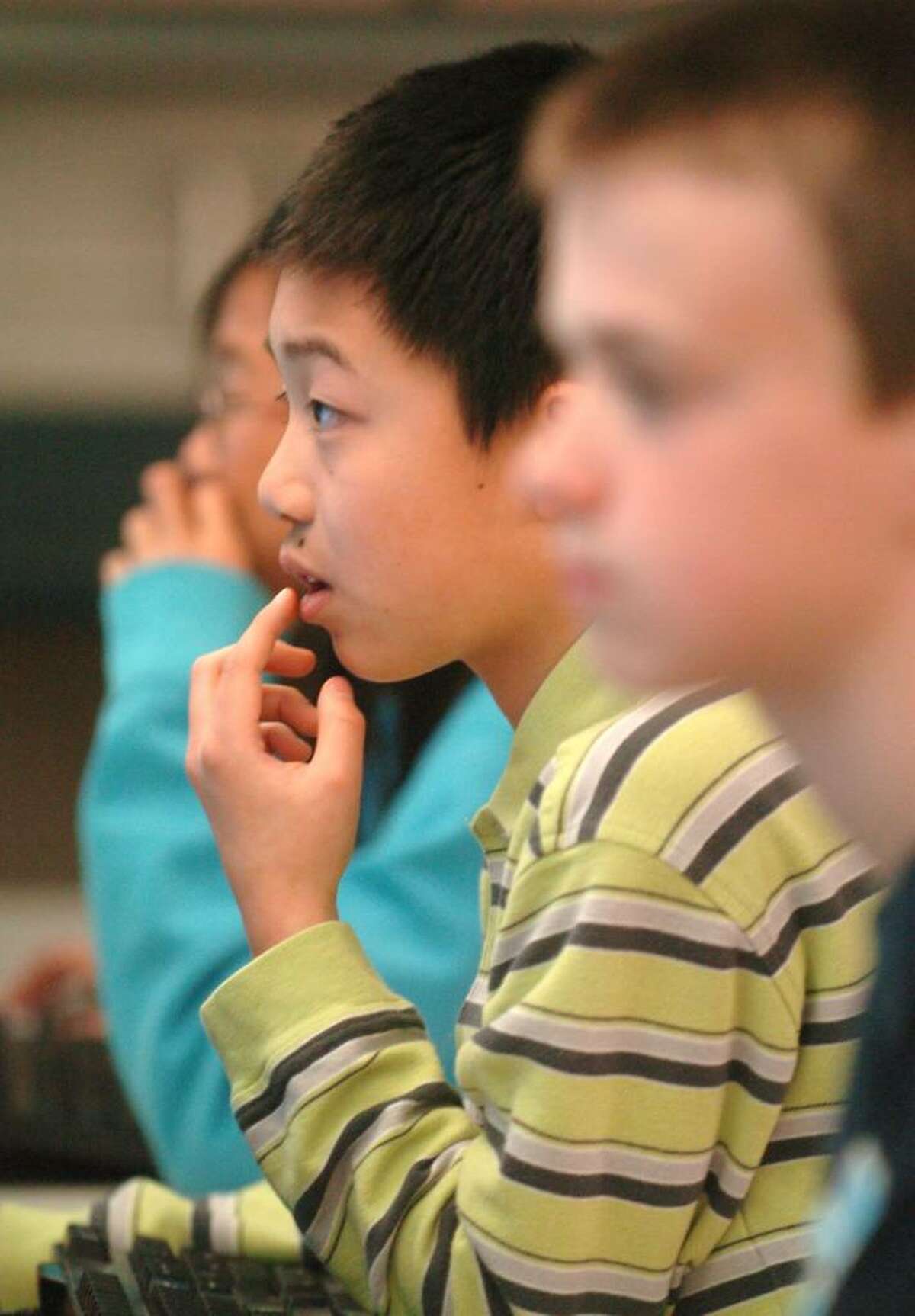 Angus Li, 11, participates in an after school stock market program at Sarah Noble Intermediate School in New Milford Friday, April 16, 2010.
