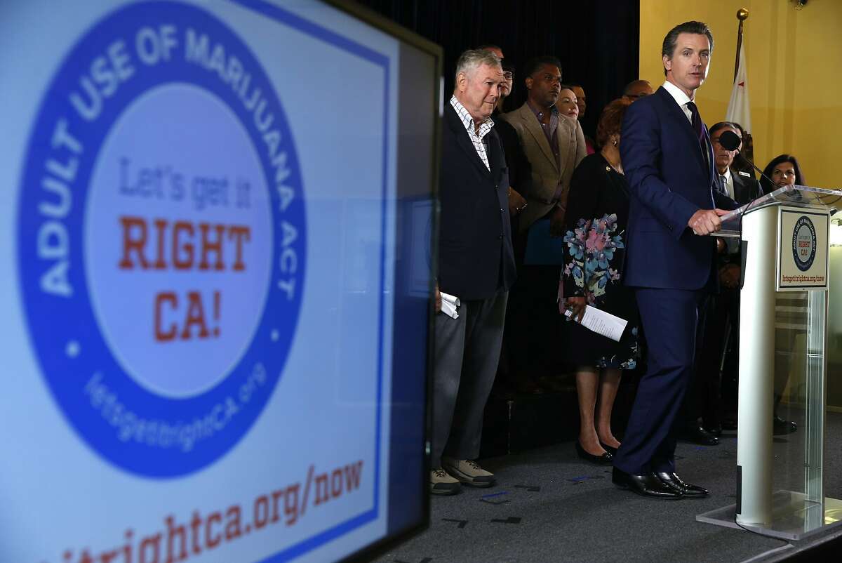 Lt. Gov. Gavin Newsom speaks at a news conference in San Francisco, Calif. on Wednesday, May 4, 2016 to announce the Adult Use of Marijuana Act has qualified for the November ballot. Joining Newsom on the stage at left is Rep. Dana Rohrabacher (R-Costa Mesa).