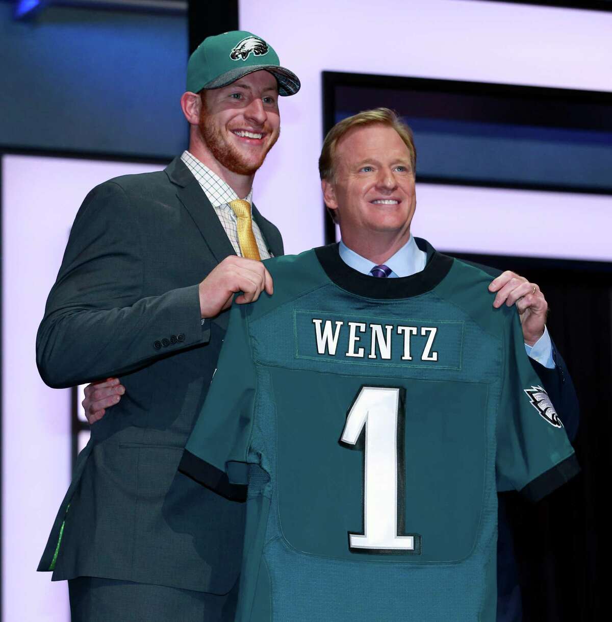 North Dakota State’s Carson Wentz poses for photos with NFL commissioner Roger Goodell after being selected by Philadelphia Eagles as second pick in the first round of the 2016 NFL football draft, Thursday, April 28, 2016, in Chicago. (Jeff Haynes/AP Images for Panini)