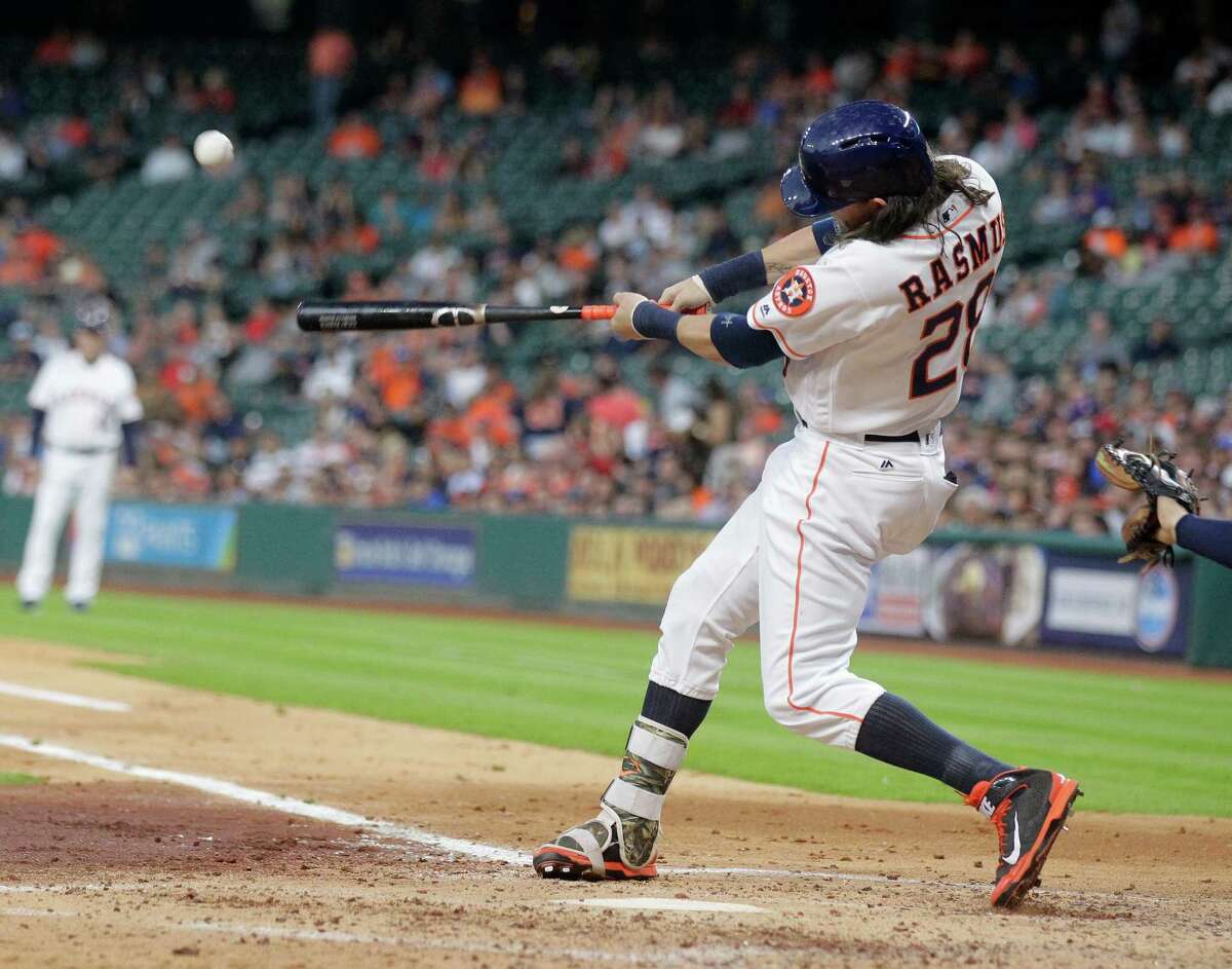 Houston Astros left fielder Colby Rasmus (28) connects for and RBI single that brings in Houston Astros right fielder George Springer (4) int he bottom of the second inning. Photos of game three between Houston Astros and Minnesota Twins on Wednesday, May 4, 2016, in Houston. The series is tied 1-1.