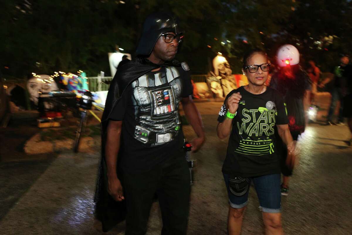 “Star Wars” fans bike riders, Phillip Johnson, 50, left, and Leonor De Jesus, 58, arrives for a May the 4th Be With You celebration at The Korova, Wednesday, May 4, 2016. Fans took on the popular quote in the “Star Wars,” movies, May the Force be with you as a reason to celebrate May 4. Bike riders from The Bike Boozaroos and Sunday Wine and Cheesy Riders Club were some of the fans enjoying “Star Wars” movies at the club.