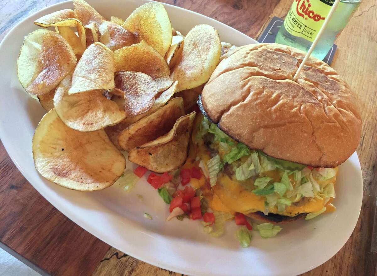 The Char King at Down on Grayson includes ground chuck, melted cheddar, mayonnaise, pickles, lettuce and tomato. It's served with a choice of fries or housemade chips.