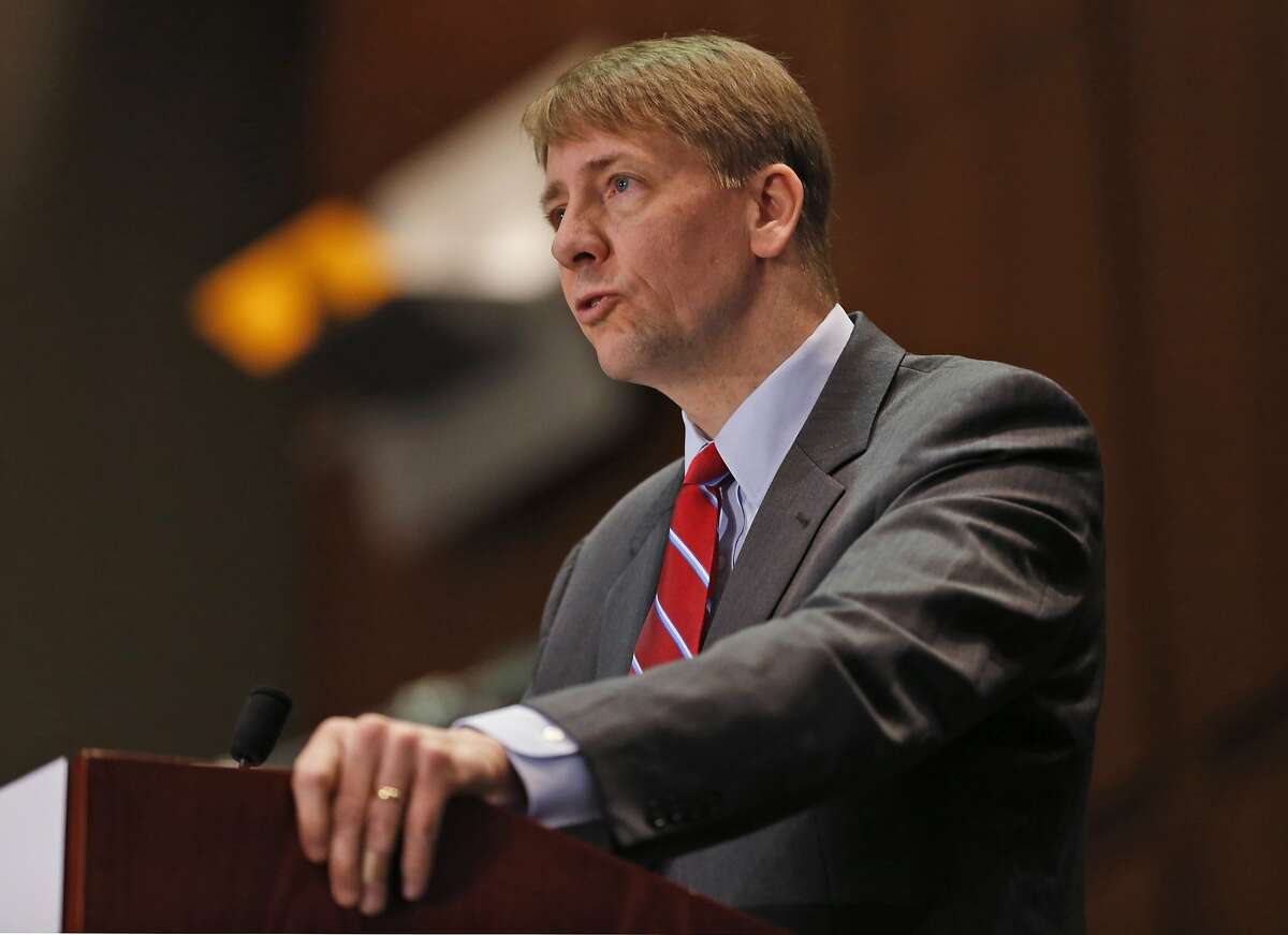 FILE - In this March 26, 2015, file photo, Consumer Financial Protection Bureau (CFPB) Director, Richard Cordray, speaks during a panel discussion in Richmond, Va. The CFPB is considering banning a practice known as forced arbitration for financial services. (AP Photo/Steve Helber, File)