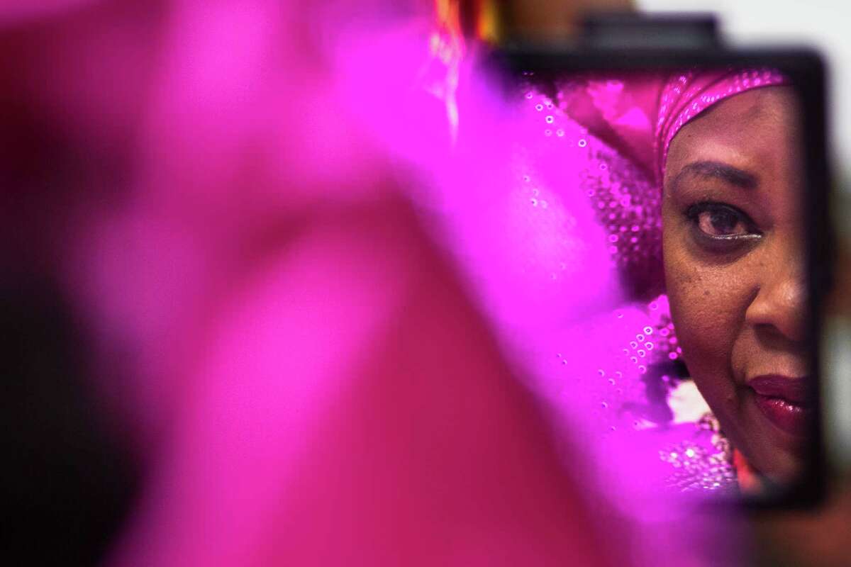 Grace Ogiehor looks at herself in a mirror as a stylist prepares a headpiece for her in preparation for the Nigerian Arts Fashion and Beauty Awards 2016, Saturday, April 30, 2016, in Houston. ( Marie D. De Jesus / Houston Chronicle )