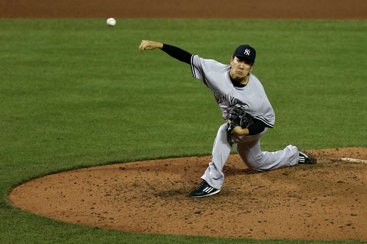 BALTIMORE, MD - MAY 05: Starting pitcher Masahiro Tanaka #19 of the New York Yankees works the fifth inning against the Baltimore Orioles at Oriole Park at Camden Yards on May 5, 2016 in Baltimore, Maryland. (Photo by Patrick Smith/Getty Images) ORG XMIT: 607677013
