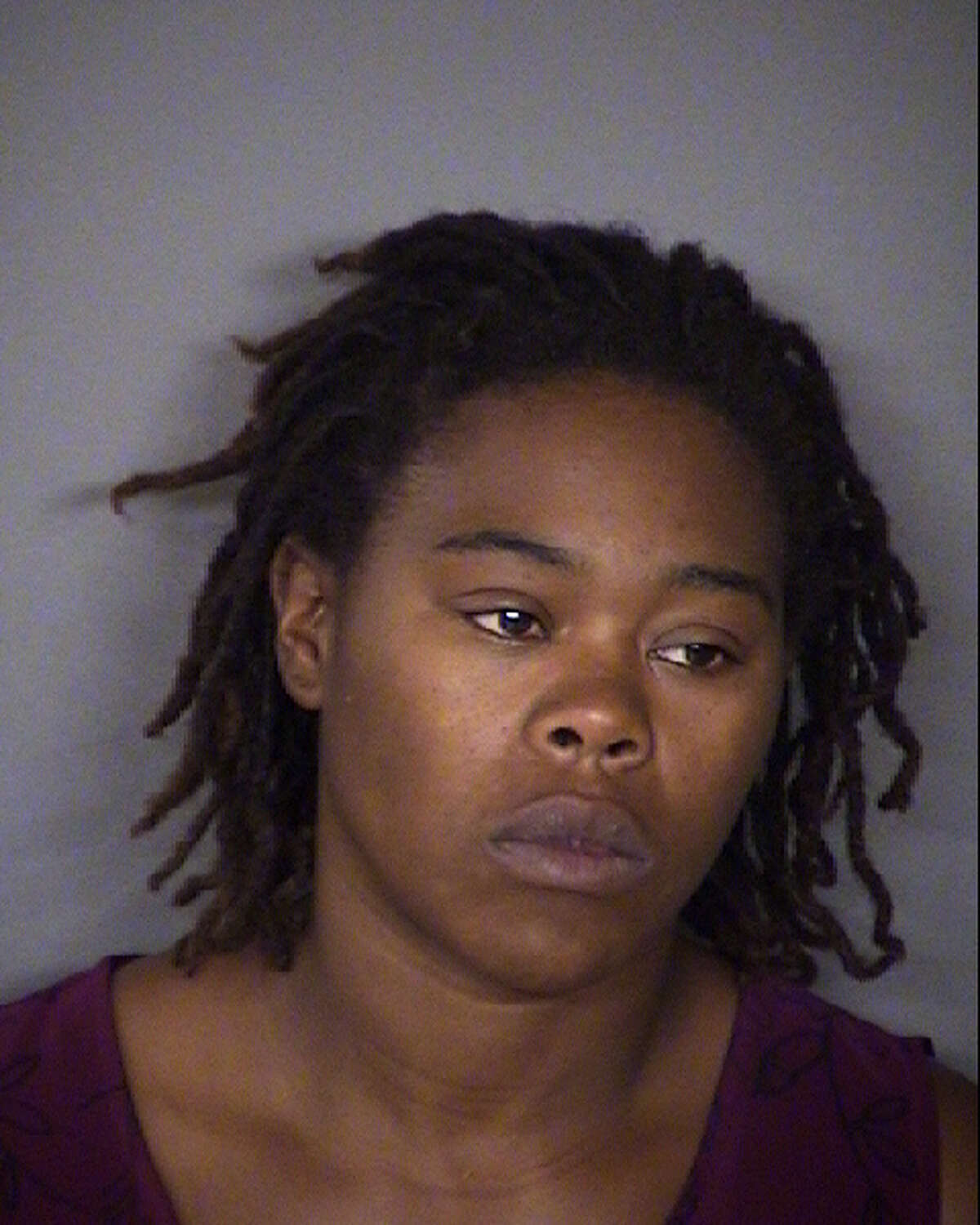 Cheryl Reed, 30, has been charged with two counts of injury to a child, according to the Bexar County Sheriff's Office
