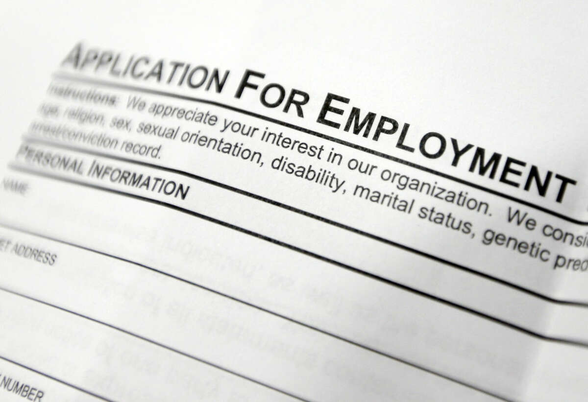This April 22, 2014, photo shows an employment application form on a table during a job fair at Columbia-Greene Community College in Hudson, N.Y. The Labor Department said Friday, May 2, 2014, that U.S. employers added a robust 288,000 jobs in April, the most in two years, the strongest evidence to date that the economy is picking up after a brutal winter slowed growth. (AP Photo/Mike Groll)