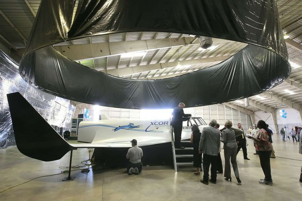 (FILE PHOTO) People gather around to get a closer look at a full scale model of the XCOR Aerospace Lynx rocket Monday following a ceremony officially announcing the companies’ relocation of its executive office's to Midland. Cindeka Nealy/Reporter-Telegram