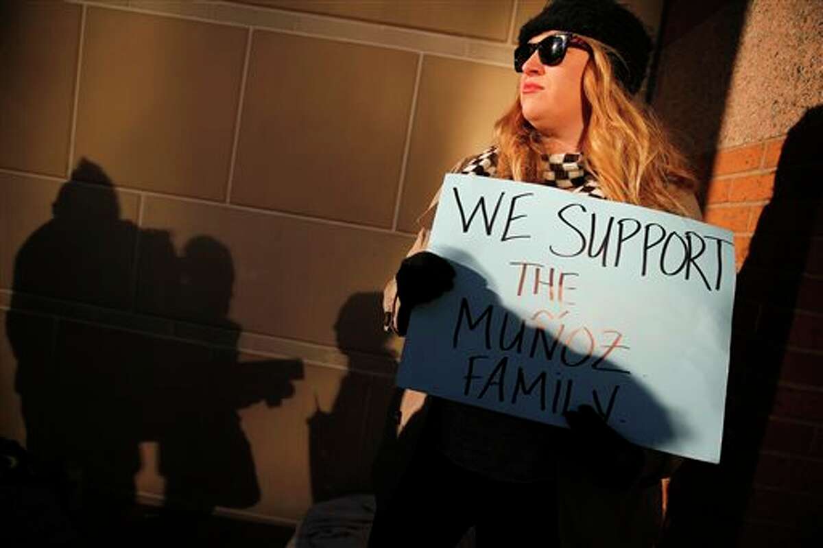 Autumn Brackeen of Fort Worth, Texas shows her support for the Munoz family outside the Tim Curry Criminal Justice Center, in Fort Worth, Texas on Friday, Jan. 24, 2014, after a judge ruled in Marlise Munoz life or death case. Erick Munoz's wife Marlise is brain dead and on life support with his unborn child at John Peter Smith Hospital. The judge has sided with the family of Marlise Munoz and ordered John Peter Smith Hospital to declare the pregnant woman dead and withdraw life support by 5 p.m. Monday. (AP Photo/The Dallas Morning News, Tom Fox)