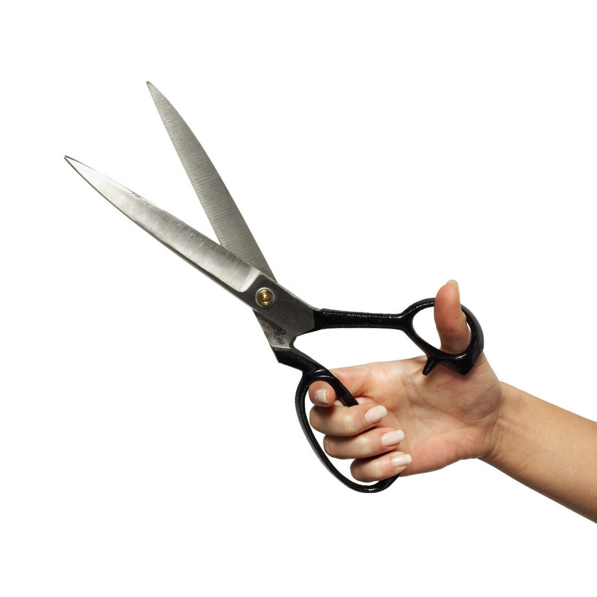 Close-up of hand holding scissors
