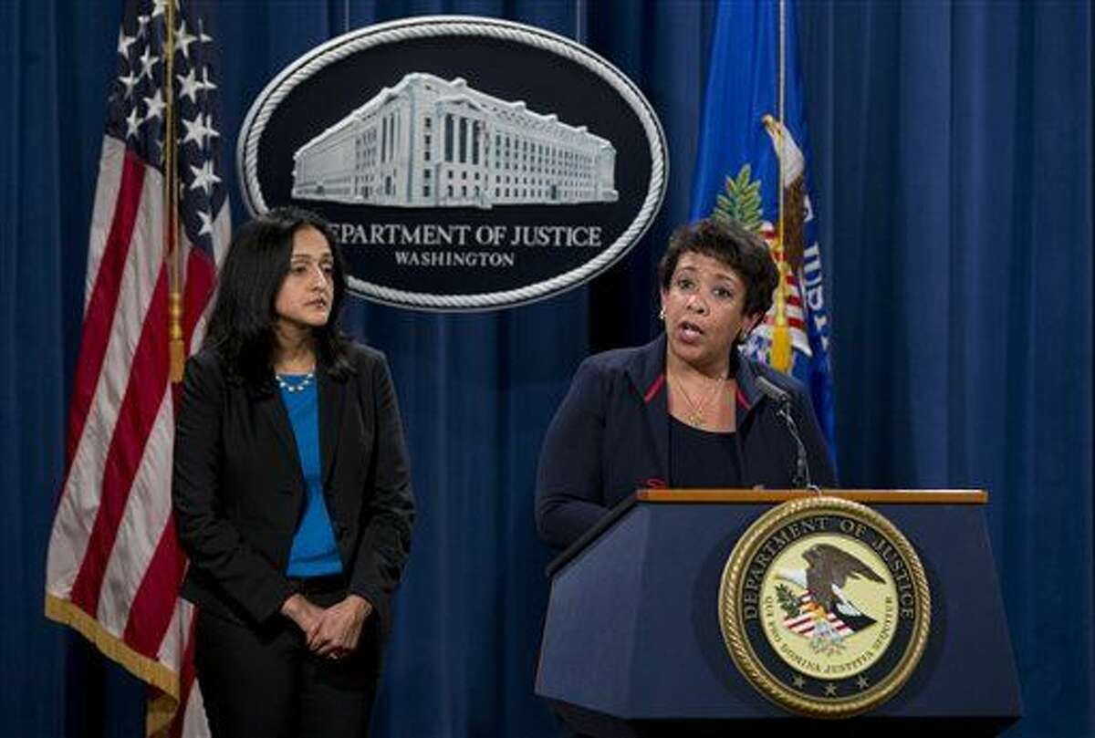 Attorney General Loretta Lynch, joined by Principal Deputy Assistant Attorney General Vanita Gupta speaks during a news conference at the Justice Department in Washington, Wednesday, Feb. 10, 2016, about Ferguson, Missouri. The federal government sued Ferguson on Wednesday, one day after the city council voted to revise an agreement aimed at improving the way police and courts treat poor people and minorities in the St. Louis suburb. (AP Photo/Carolyn Kaster)