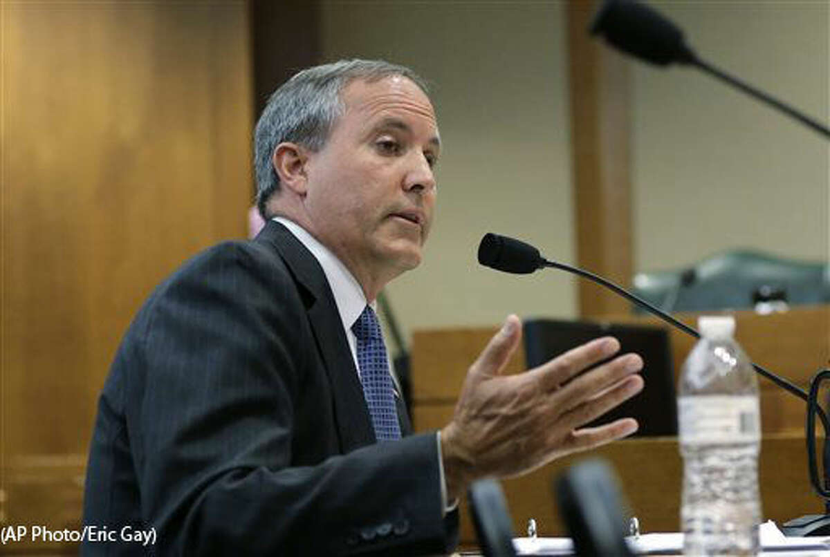 FILE - In this July 29, 2015 file photo, Texas Attorney General Ken Paxton speaks during a hearing in Austin, Texas. Already indicted on felony securities fraud charges, Paxton will face an ethics investigation for advising local officials they could refuse to issue same-sex marriage licenses on religious grounds. (AP Photo/Eric Gay)