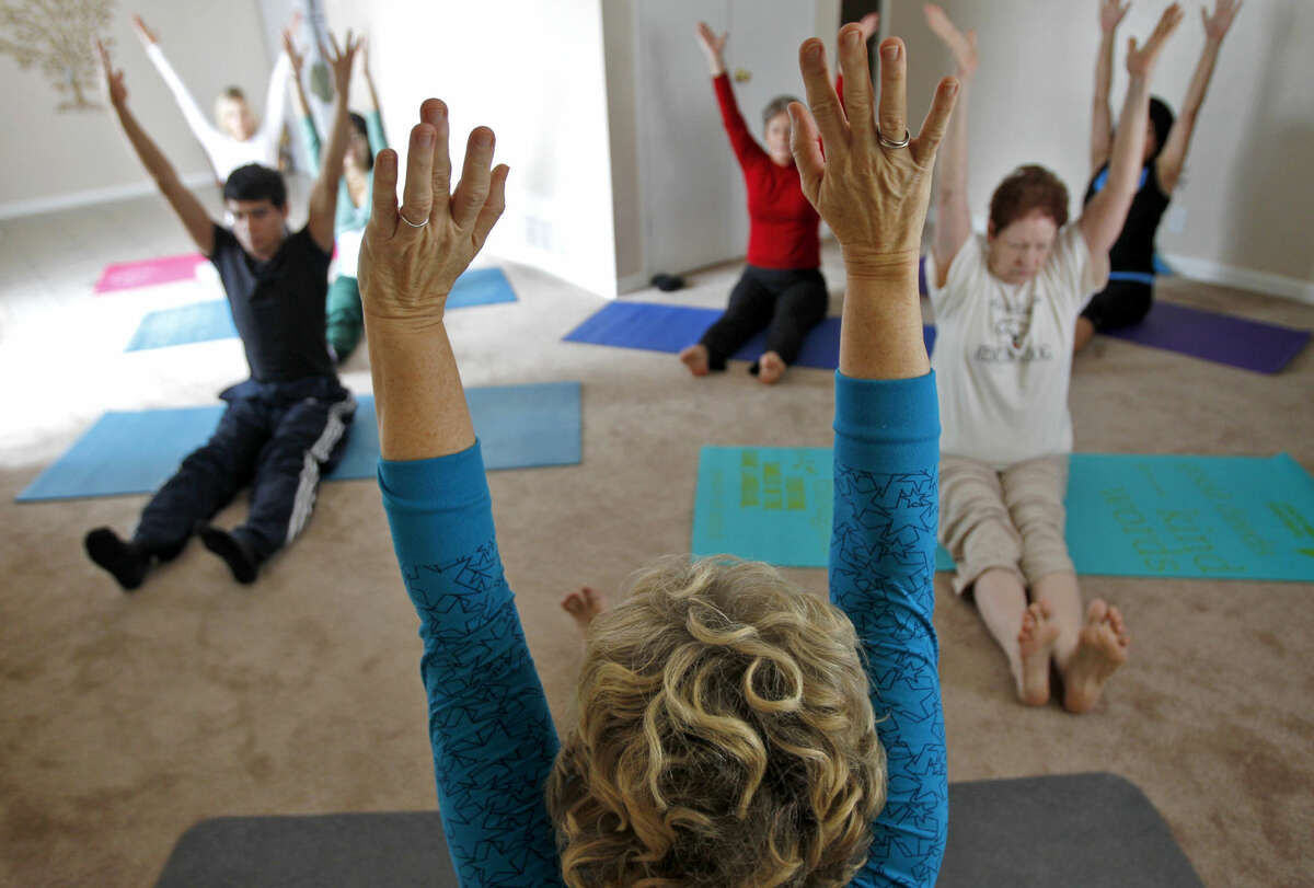 Anne Lucero instructs a yoga class at her apartment in Midland in this MRT file photo. James Durbin/Reporter-Telegram