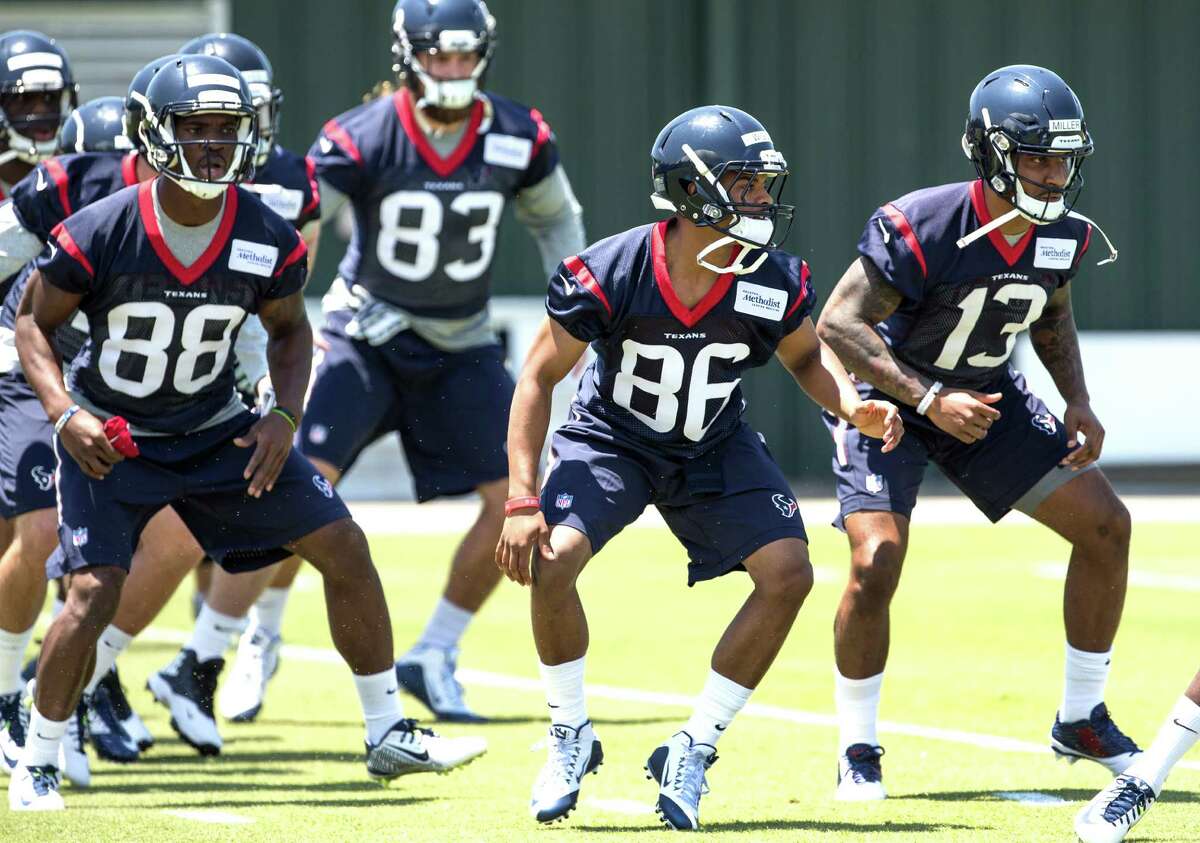 Houston Texans wide receivers Tevin Jones (88), Carlos Wiggins (86) and Braxton Miller (13) warm up during rookie mini camp at The Methodist Training Center on Friday, May 6, 2016, in Houston.