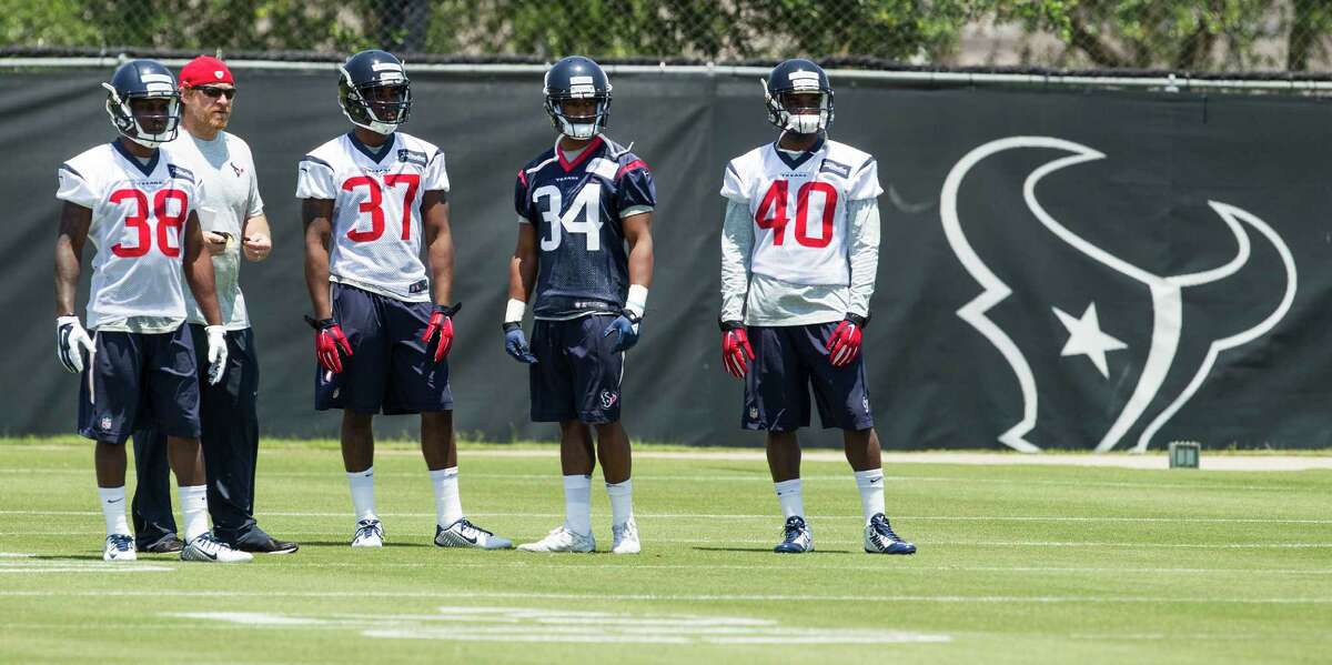 Houston Texans cornerback Richard Leonard (38), cornerback Cleveland wallace III (37), running back Tyler Ervin (34) and cornerback Duke Thomas stand on the practice field waiting to field punts during rookie mini camp at The Methodist Training Center on Friday, May 6, 2016, in Houston.