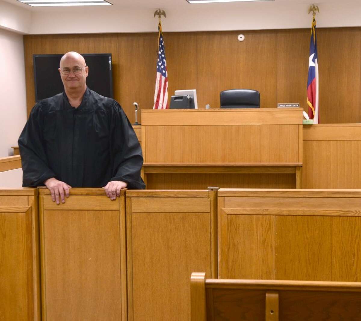 Judge Robin Smith stands in his courtroom in the Municipal Courthouse on Illinois. Midland City Council is looking for a larger building to move the court into. Photo by Tim Fischer/Midland Reporter-Telegram
