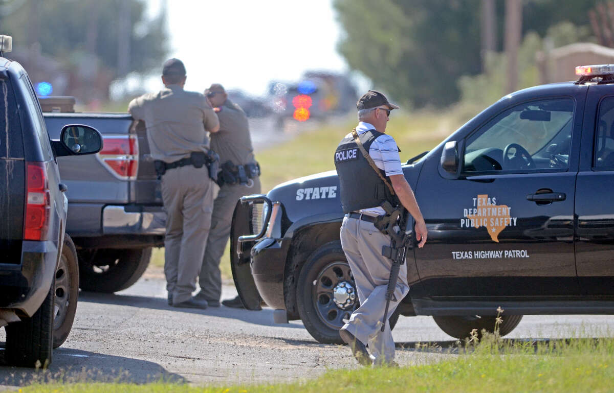 Midland emergency personnel respond to a standoff near Briarwood Avenue and Highway 158 on Thursday. Midland County Sheriff's Office Sgt. Mike Naylor was shot and killed while he was serving a warrant Thursday afternoon.