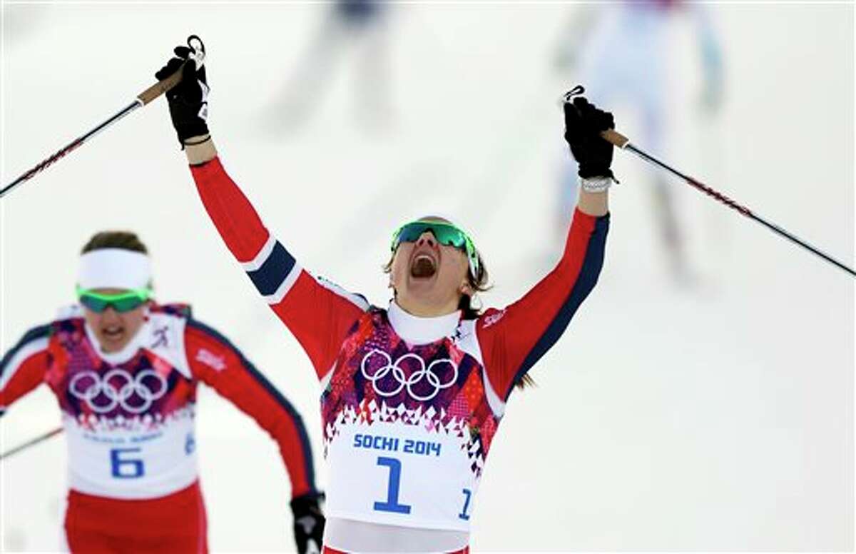 Norway's Maiken Caspersen Falla crosses the finish line to win gold in the final of the women's cross-country sprint at the 2014 Winter Olympics, Tuesday, Feb. 11, 2014, in Krasnaya Polyana, Russia. (AP Photo/Matthias Schrader, File)