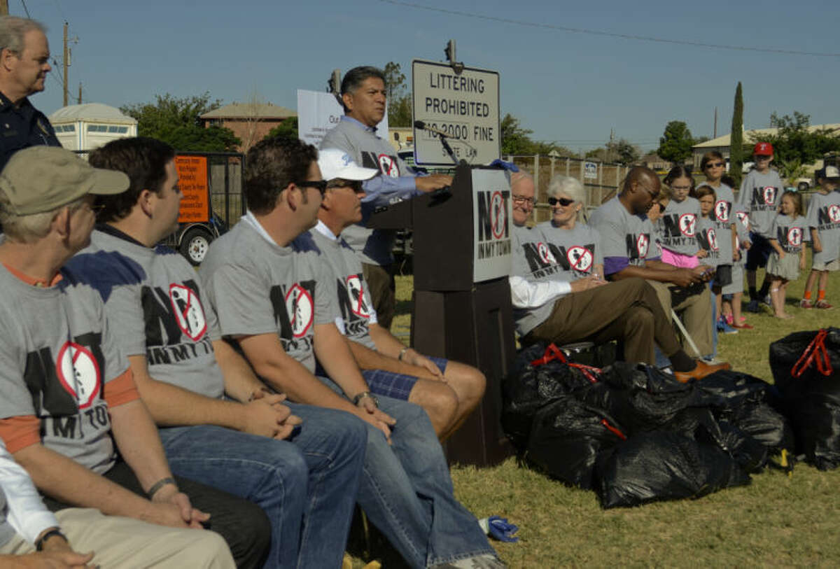 Mayor Jerry Morales helps kick off the anti-litter campaign, Not in My Town, Tuesday morning. Tim Fischer\Reporter-Telegram