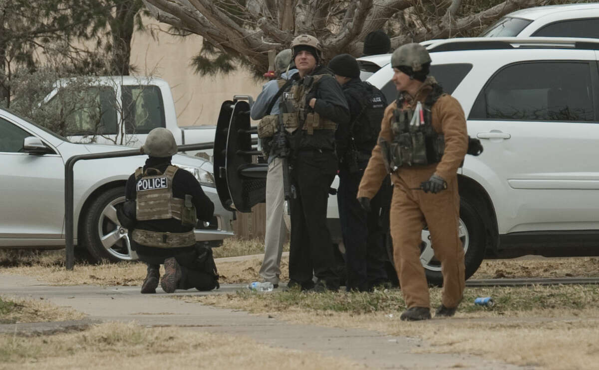Midland police and SWAT units respond to an armed subject Monday morning in the 2700 block of W. Washington. Tim Fischer\Reporter-Telegram