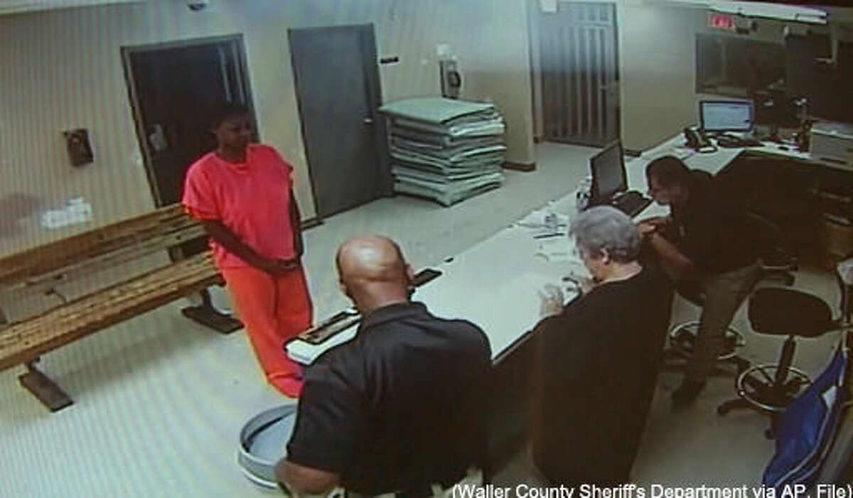 FILE - In this undated file image made from video provided by the Waller County Sheriff's Department, Sandra Bland stands before a desk at Waller County Jail in Hempstead, Texas. The small-town Texas jail where Sandra Bland died last summer needs to be replaced, and its jailers need body cameras and anger-management training, according to a report issued Tuesday, April 12, 2016 by a panel convened after Bland's death. (Waller County Sheriff's Department via AP, File)