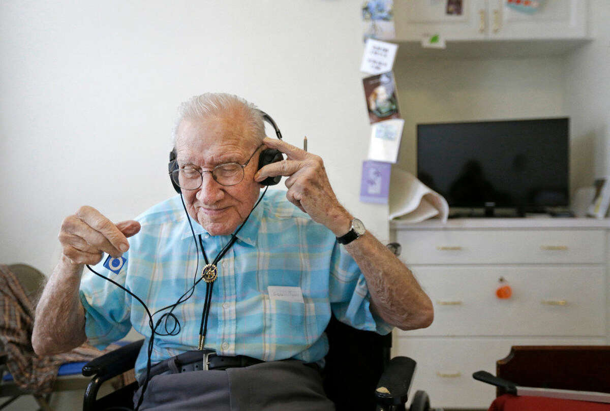 Walter Jones talks about his enjoyment of music Friday, April 15, 2016, at Holly Hall, 2000 Holly Hall St., in Houston. Last year, the state piloted a program that uses music to help aid the memory of nursing home residents. Three Houston facilities, including Holly Hall, were part of the program. Participates listen to music on an iPod Shuffle. He also has a collection of Big Band cassette tapes and a player in his room. ( Melissa Phillip / Houston Chronicle )