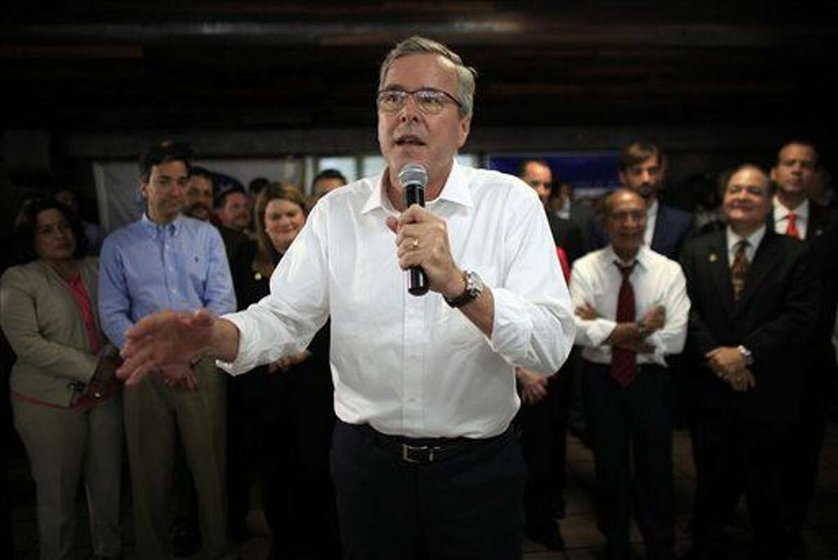 FILE - In this April 28, 2015 file photo, former Florida Gov. Jeb Bush speaks during a town hall meeting with Puerto Rico's Republican Party in Bayamon, Puerto Rico. Bush on Wednesday declared that 11 million immigrants in the country illegally should have an opportunity to stay, wading into the explosive immigration debate for the second time in two days while courting Hispanic voters. (AP Photo/Ricardo Arduengo, File)