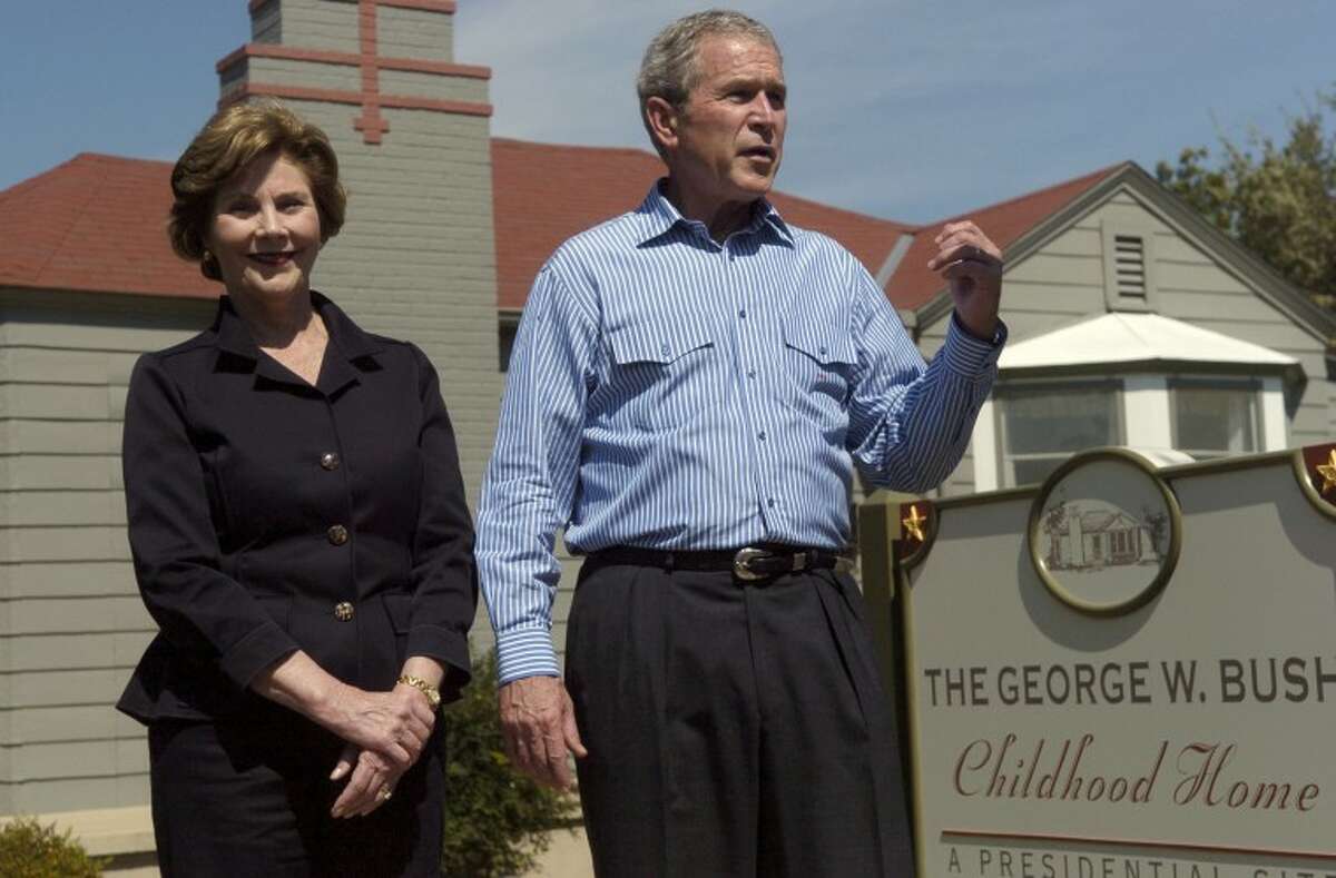 President George and Laura Bush talk about walking through his childhood home, at 1412 West Ohio, after they toured the home restored to it's 1950's era Saturday afternoon following the Bush's attendance at a Republican funraiser. Photo by Tim Fischer 10\4\08