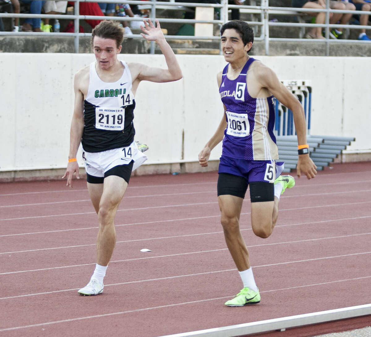 Midland junior Bryce Hoppel passes Southlake Carroll's Johnny Kemps at the end of the 1600M run during the UIL 6A Region 1/5A Region 2 Track and Field Championship on Saturday at Maverick Stadium in Arlington. Hope finished in second with a 4:18.12 run.