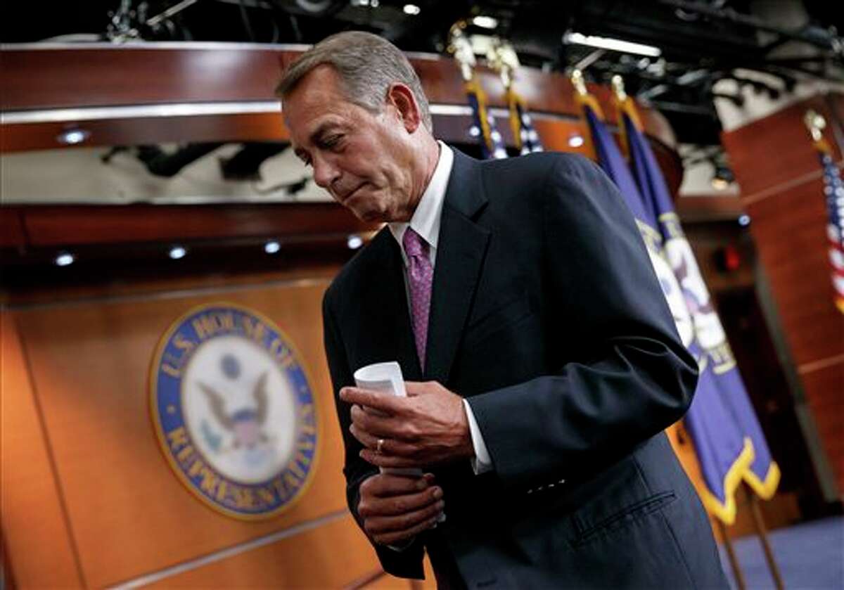 House Speaker John Boehner of Ohio wraps up a news conference on his legislative agenda, Wednesday, March 26, 2014, on Capitol Hill in Washington. Boehner touched on the Ukraine crisis, relations with Russia, the NSA surveillance program, jobs and other issues. (AP Photo/J. Scott Applewhite)