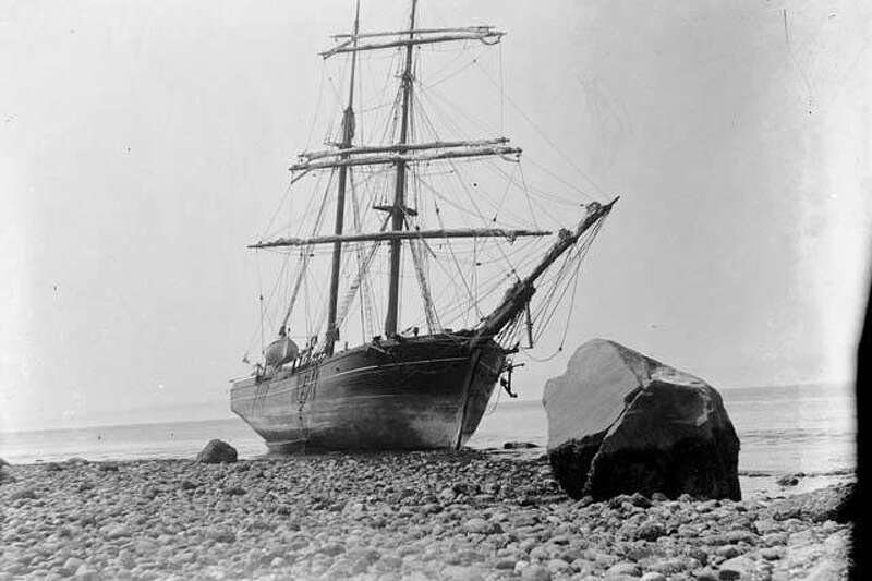 "The "Tanner" was one of the earliest vessels to make regular trips between San Francisco and Puget Sound. In 1866, the vessel arrived in Seattle carrying some of the Mercer Girls on the last leg of their voyage from the east coast. By 1900, the days of sailing ships had passed. The "Tanner" ended its days in 1902, beached and abandoned at Port Townsend, on Washington's Olympic Peninsula. This photo, taken in 1902 by James G. McCurdy, shows the old sailing ship "Tanner" on the beach at Port Townsend, Washington." -MOHAI. Courtesy MOHAI, James G. McCurdy photograph, image number 1955.970.627.