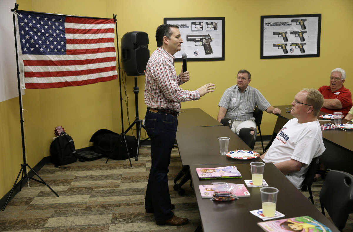 Republican presidential candidate, Sen. Ted Cruz, R-Texas, speaks during a "Celebrate the 2nd Amendment Event," Saturday, June 20, 2015, at the CrossRoads Shooting Sports in Johnston, Iowa. (AP Photo/Charlie Neibergall)This photo of a picture of a gun pointed at Cruz's head is seen as in poor taste by many people.