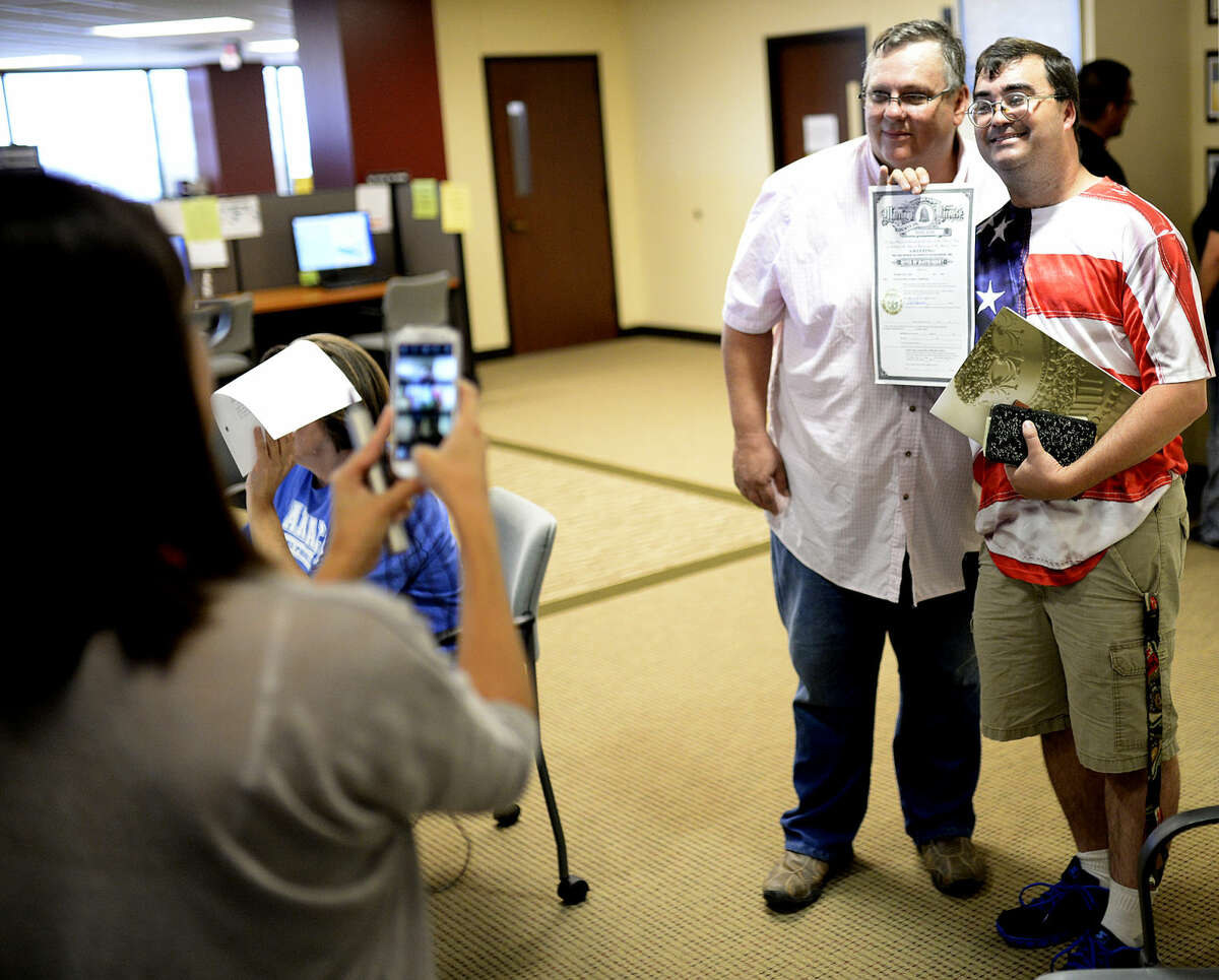 Same-sex couples collect marriage licenses