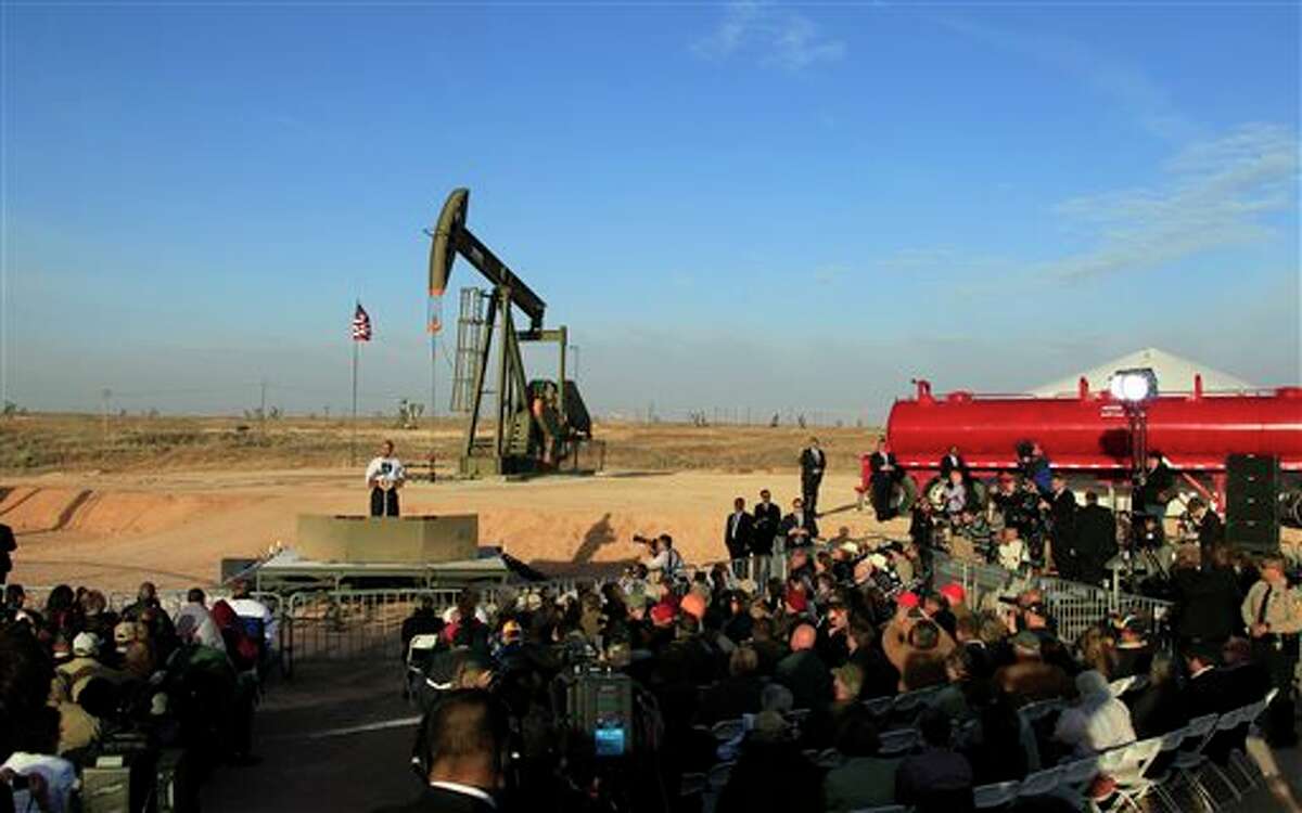 FILE - In this March 21, 2012, file photo, with oil pump jacks as a backdrop, President Barack Obama speaks at an oil and gas field on federal lands in Maljamar, N.M. The government has failed to inspect thousands of oil and gas wells it considers potentially high risks for water contamination and other environmental damage, congressional investigators say. The report, obtained by The Associated Press before its public release, highlights substantial gaps in oversight by the agency that manages oil and gas development on federal and Indian lands. (AP Photo/Ross D. Franklin, File)
