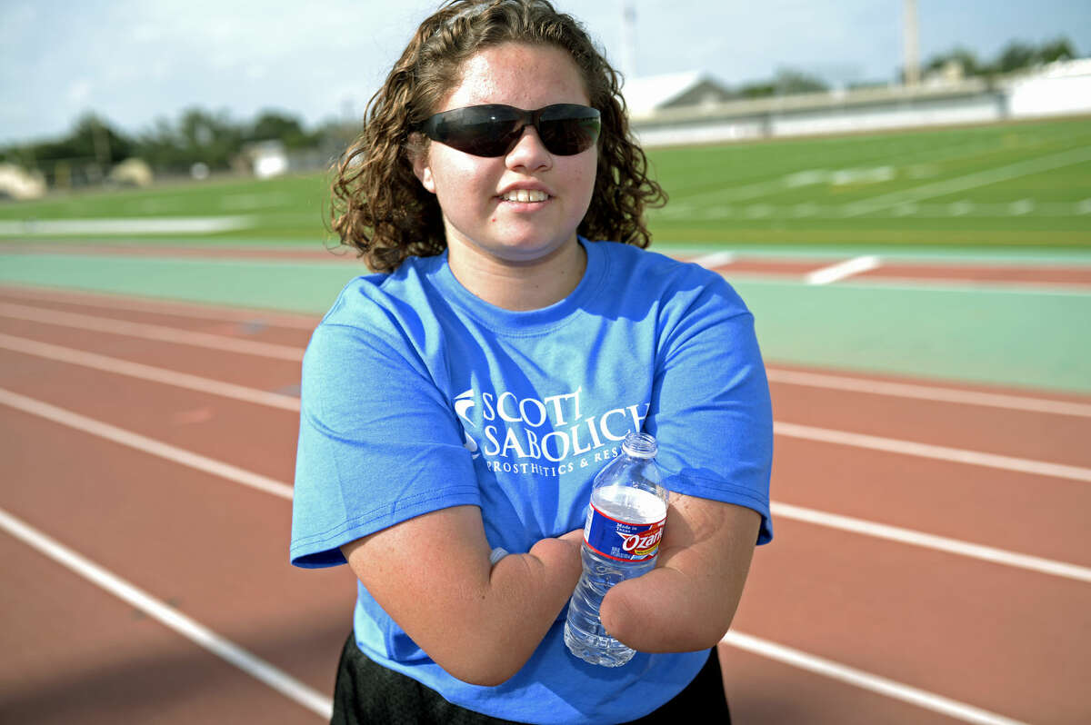 Vanessa Rodriguez pauses for a water break after sprinting during a portrait session with the Reporter-Telegram on Friday, July 10, 2015, at Memorial Stadium. James Durbin/Reporter-Telegram