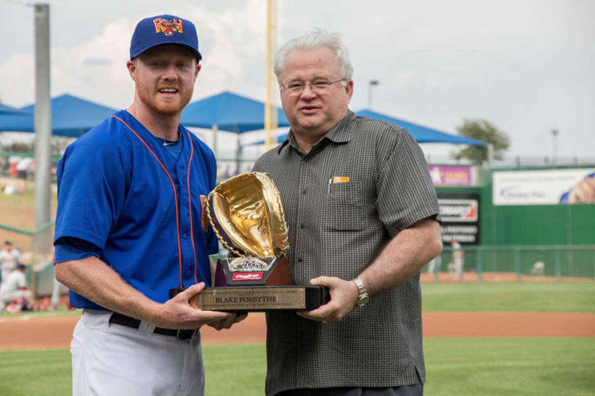 Midland RockHounds catcher Blake Forsythe, left, is presented his Rawlings Gold Glove Award for the 2013 season prior to Thursday night's RockHounds game at Security Bank Ballpark. Minor League Baseball President and CEO Pat O'Connor is on the right. Photo by Cassie Thornton