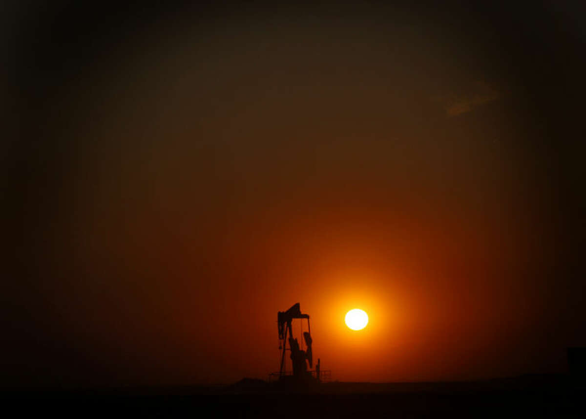 The sun sets behind a pumpjack near FM 829 in Stanton on Wednesday. James Durbin/Reporter-Telegram