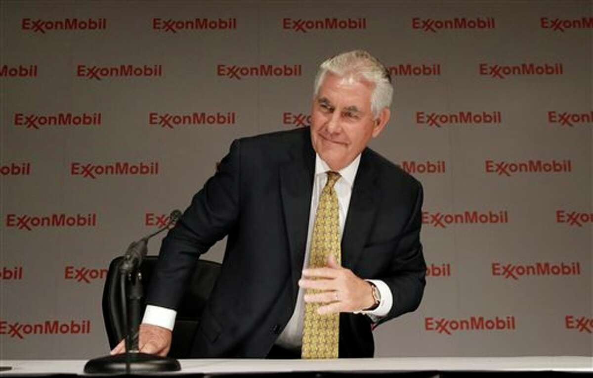 ExxonMobil CEO Rex Tillerson concludes an availability with reporters after the annual meeting ExxonMobil shareholders meeting in Dallas, Wednesday, May 28, 2014. (AP Photo/LM Otero)