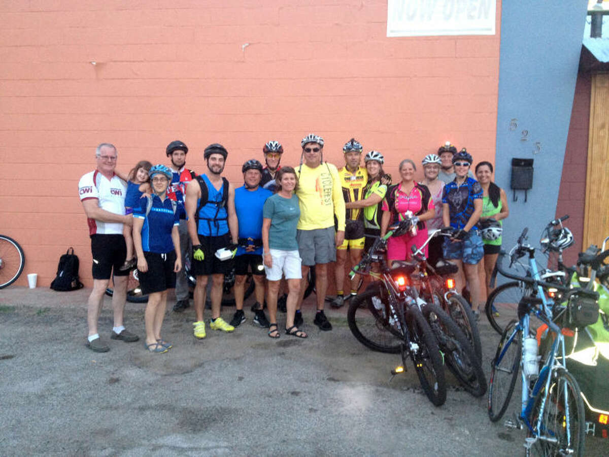 Riders pose for a group picture outside Casa Del Sol restaurant during a City Ride event August 22, 2013. Photo courtesy of Peytons Bikes.