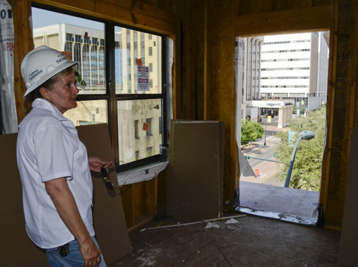 Project superintendent Angel Warner shows one of the views from a fourth floor loft as construction on the Wall Street Lofts continues as builders ready the new apartments and lofts for residents. Tim Fischer\Reporter-Telegram