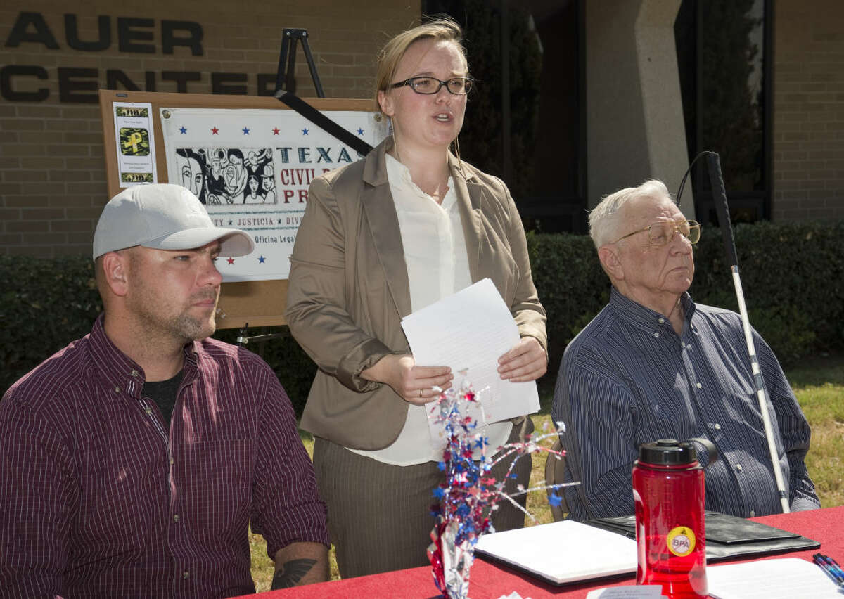 Cassandra Champion, center, regional director and Veterans rights attorney with Texas Civil Rights Projects, speaks Monday 7-27-15, with U.S. Army veteran Richard Vernon and Melvin Burdick, right, who is visually impaired. Tim Fischer\Reporter-Telegram
