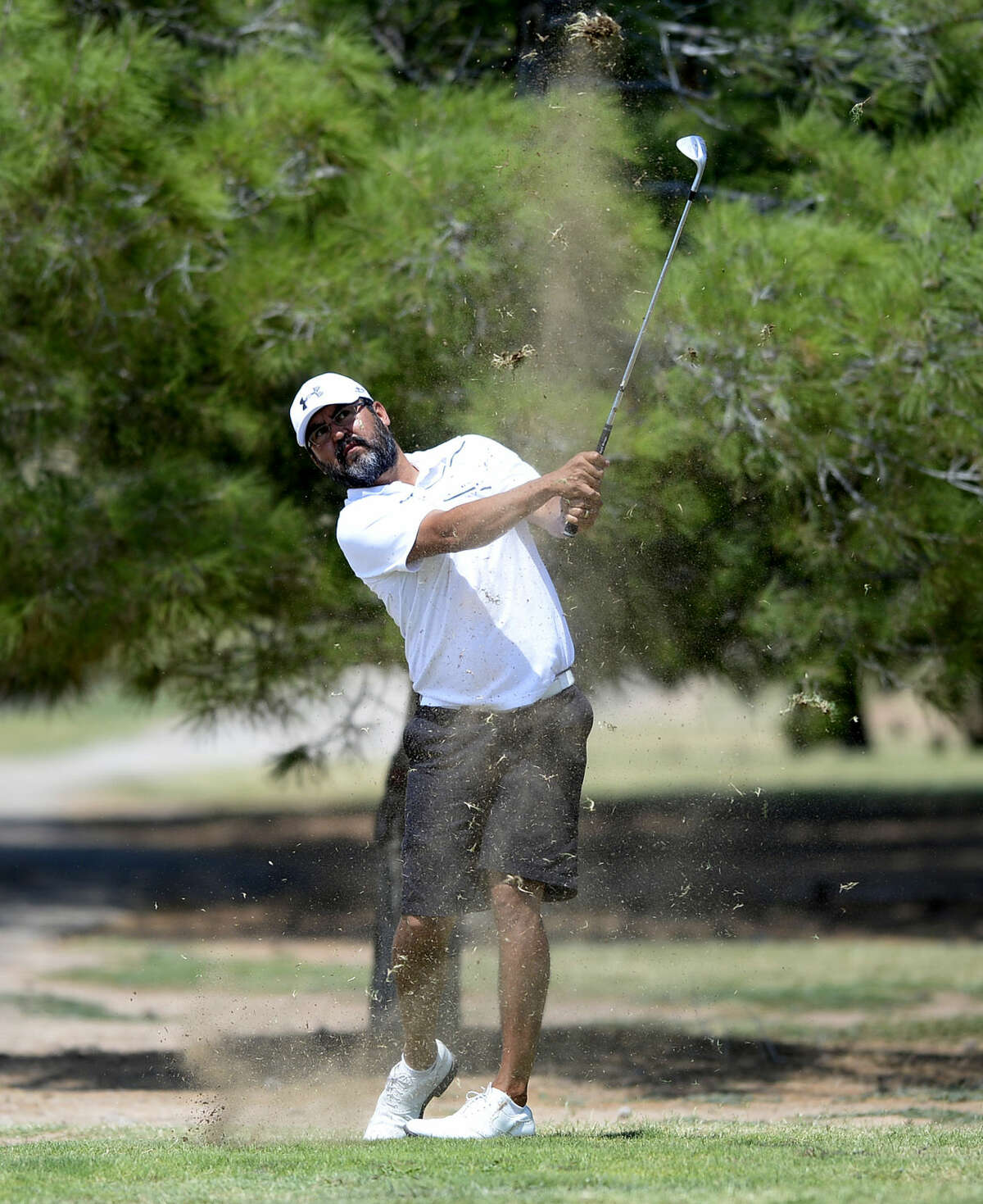 Ciro Baeza hits an approach shot during the Star Electric Men's City Championship on Saturday, August 1, 2015 at Hogan Park Golf Course. James Durbin/Reporter-Telegram