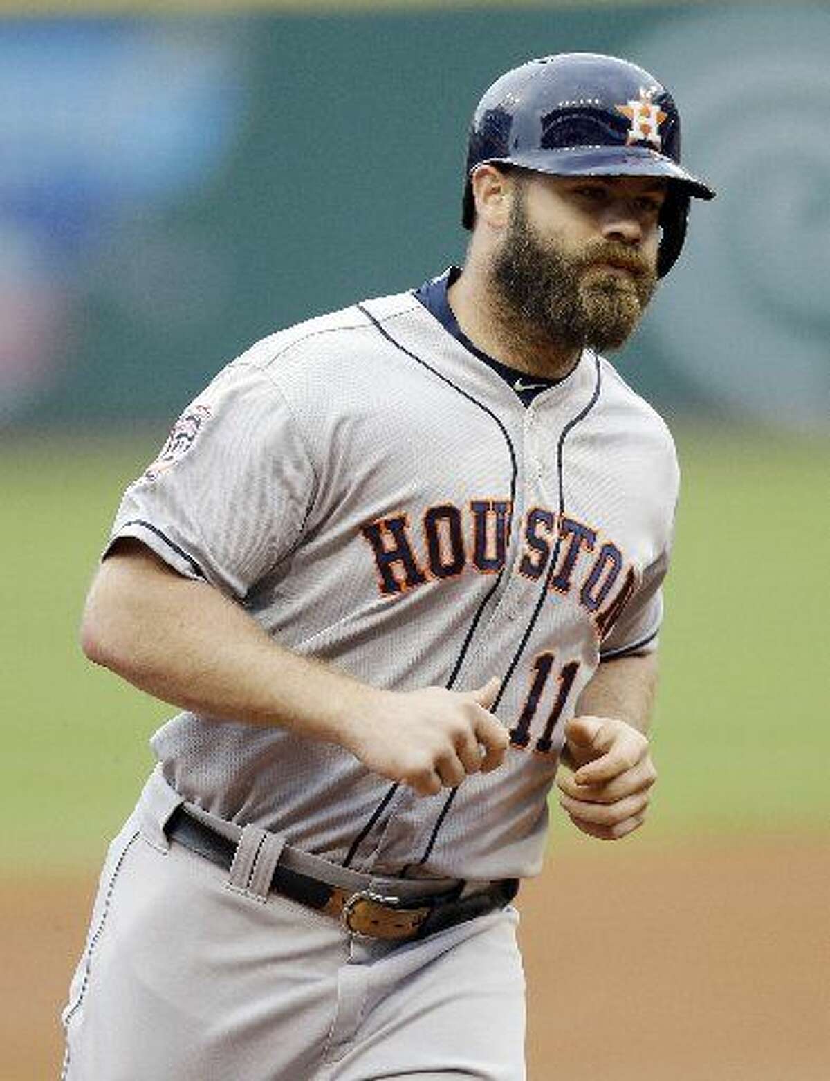 Houston Astros' Evan Gattis runs the bases after hitting a two-run home run off Cleveland Indians starting pitcher Trevor Bauer in the first inning of a baseball game, Wednesday, July 8, 2015, in Cleveland. Jose Altuve scored on the play. (AP Photo/Tony Dejak)