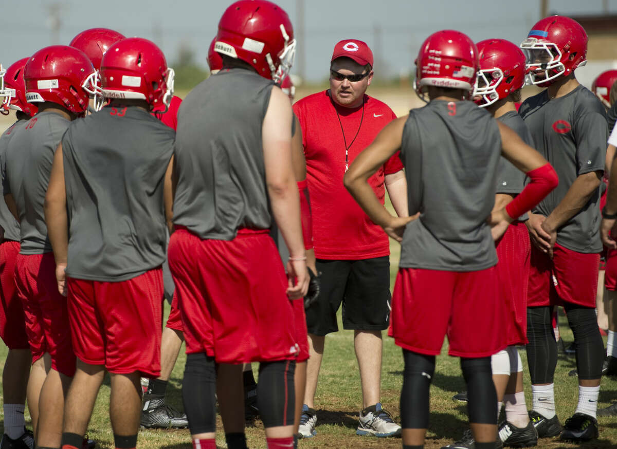 Coahoma's new head coach Fred Dietz works with his players Wednesday 8-5-15, during practice. Tim Fischer\Reporter-Telegram