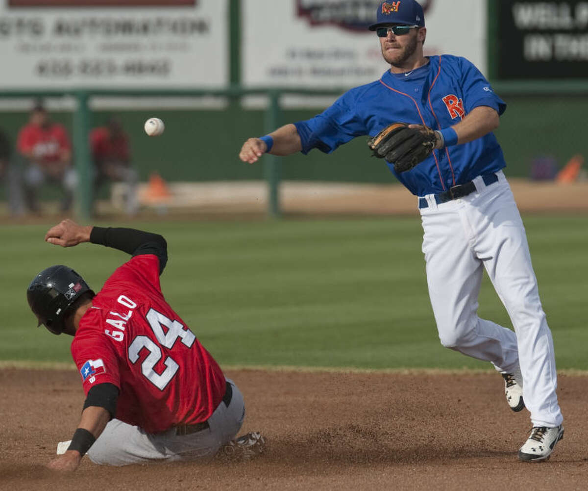 RockHounds' Dusty Coleman gets the force out at second on RoughRiders' Joey Gallo but can not complete the double play to first Monday evening at Security Bank Ballpark. Tim Fischer\Reporter-Telegram